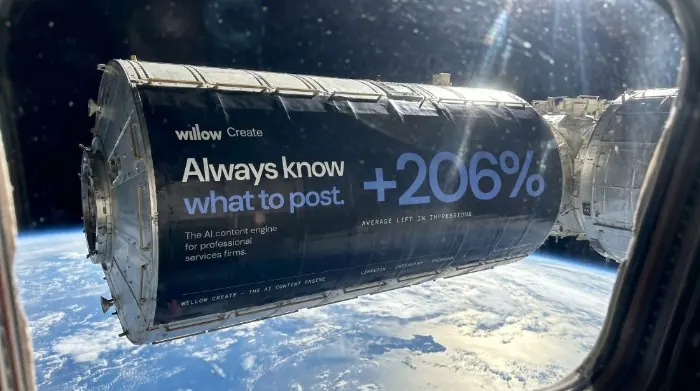 Willow Create wrap on a space-station module reading 'Always know what to post. +206%.'